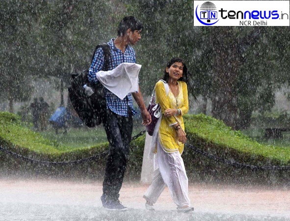 Youth enjoy the rain on India Gate lawns, in New Delhi photo byb sp rana