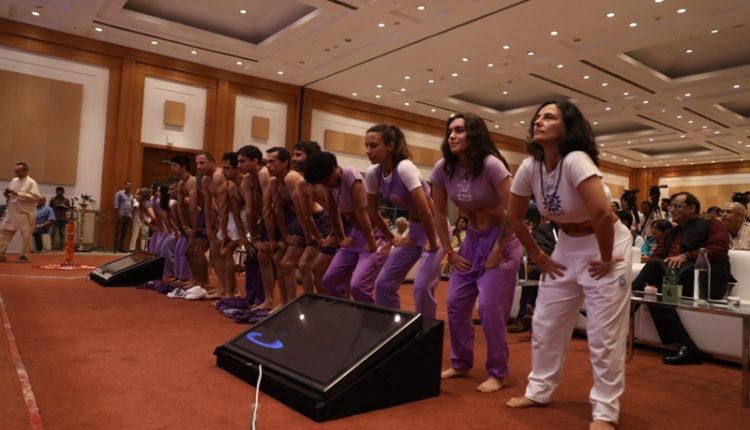 PHOTO 6 YOGA IS BEING PERFORMED BY DELEGATES FROM PORTUGAL
