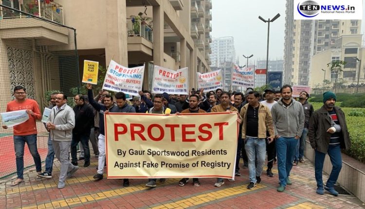 Gaur Sports Wood residents hold protest against builder demanding registry of flat