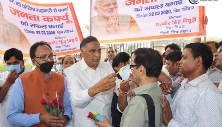 LOP Bidhuri distributes sanitizers, masks and roses in Delhi to aware people of 'Janta Curfew'