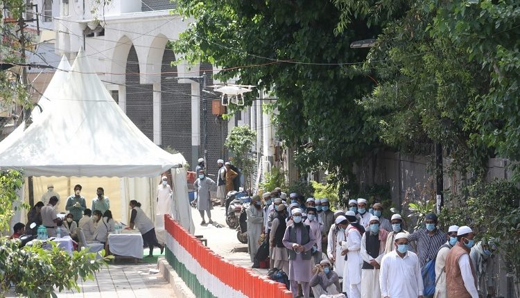 New Delhi: Suspected coronavirus patients being taken to Lok Nayak Jai Prakash Narayan Hospital from Delhi’s Nizamuddin area where a religious congregation of 2000 people at a mosque has thrown up several corona positive cases as six of the persons who returned to Telangana have died from the virus and positive cases are emerging from at least five regions including J&K, Tamil Nadu, Andhra Pradesh and the Andaman and Nicobar islands; on March 31, 2020. The suspected outbreak was discovered earlier today in Delhi as it emerged that several hid their travel history to foreign countries and a large congregation was held on March 13-5 at the at the Tabligh-e-Jamaat’s Markaz in Nizamuddin. The area was sealed today and hundreds of those present were whisked away to hospitals. With this the coronavirus death toll in the country is 43 while the total number of cases has risen to 1,280. (Photo: IANS)