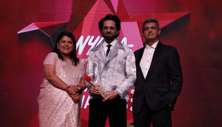 Ayushmann Khurrana received Dapper Disruptor of the Year award & recieved it from Falguni Nayar the Founder & CEO of Nykaa & Deepak Lamba, CEO WWM